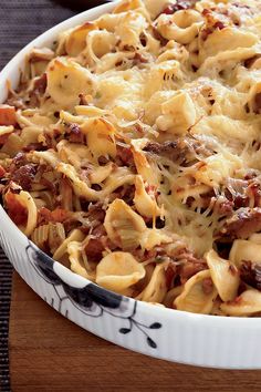 a casserole dish filled with pasta and meat