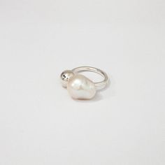 Designer Notes + Baroque pearl silver ball ring. Model is wearing size 6 ( US ring size ) . Details + •Color: Gold Vermeil - 18K Solid gold vermeil plated Sterling silver. Sterling Silver plated in rhodium. • Handcrafted by artisans in New York City. • Care: Keep airtight (concealed) to maintain color and shine. Refrain from touching or putting stress on the chains Chloe Ring, Ring Model, Phone Items, Contemporary Jewelry, Silver Pearls, Baroque Pearls, Pearl Ring, Luxury Women, Cocktail Ring