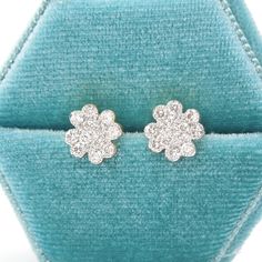 If it's the luck of the Irish you need, then the luck of the Irish you shall have!These petite stud earrings (they measure 8.5mm in diameter, which is about the size of a 2.4 ct diamond) are made of 18K yellow gold and in the shape of a four leaf clover. A combined total of 0.66 carats of diamonds cover the rhodium plated top of each stud, ensuring that these diamonds stay looking stark white! They come with an extra large butterfly nut to keep them securely in place. Metal: 18K Yellow Gold Gift Diamond Earrings With Brilliant Cut In Flower Shape, Diamond Flower Shaped Earrings With Brilliant Cut For Gifts, 14k White Gold Flower-shaped Diamond Earrings, Diamond White Brilliant Cut Flower Earrings As Gift, Diamond White Flower-shaped Diamond Earrings As Gift, White Gold Flower Earrings With Brilliant Cut, Diamond White Round Flower Earrings In Fine Jewelry, Diamond White Round Flower Earrings Fine Jewelry, Diamond Flower Earrings With Prong Setting As Gift