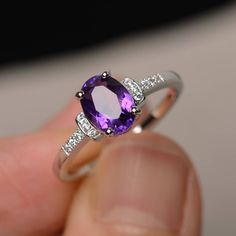 This is a gorgeous handmade creation. Its beauty is its simplicity & Elegance. The 6*8mm oval cut natural amethyst is crafted in solid sterling silver and with rhodium plated. It is available to customized, if you have any mind, just let me know, we will discuss with it. All item is sent in a beautiful gift box You can realize more lovely stuff clicking the link https://www.etsy.com/shop/knightjewelry?refshopsection_shophome_leftnav Please leave the correct address and you PHONE NUMBER for d February Birthstone Ring, Amethyst Ring Engagement, Ring Purple, Purple Amethyst Ring, Wedding Rings Unique, February Birthstone, Ring Oval, Amethyst Purple, Pink Gemstones