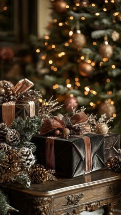 a christmas tree is decorated with presents and pine cones