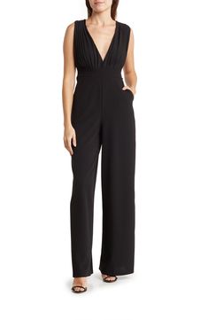 Pleat details add texture to a wide leg jumpsuit that is perfect for any special occasion. 59.5" length V-neck Sleeveless Pleat details Dual side pockets Wide legs 95% polyester, 5% spandex Hand wash Imported Model stats: 5'10" height, 32" bust, 25" waist, 36" hip. Model is wearing size S V-neck Jumpsuit With Pockets For Day Out, Black V-neck Jumpsuits For Summer, Boat Neck Jumpsuit, Versatile Black V-neck Jumpsuits And Rompers, Black High Stretch V-neck Jumpsuits And Rompers, Black Tie Optional, Black V-neck Jumpsuit With Pockets, Daytime Dresses, Jumpsuit With Sleeves