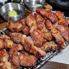 the meat is being cooked and ready to be served on the grill for people to enjoy