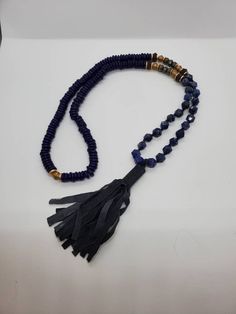 Vintage Marisa Mason glass bead and Lapis tassel necklace The necklace is absolutely stunning is made of cobalt blue glass beads hand carved lapis stone and a beautiful leather tassel it's in remarkable condition and is approximately 36 in Long Elegant Blue Tassel Necklace Gift, Elegant Blue Tassel Necklace As Gift, Blue Beaded Tassel Long Necklace, Blue Beaded Long Tassel Necklace, Handmade Blue Adjustable Tassel Necklace, Handmade Adjustable Blue Tassel Necklace, Handmade Blue Tassel Necklace With Round Beads, Blue Beaded Tassel Necklace, Blue Tassel Necklace With Round Beads For Gift