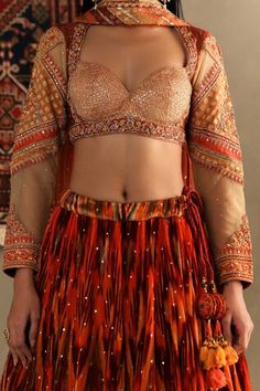 Orange silk geometric print lehenga featuring sequin embellishments and embroidered border. Comes with matching thread embroidered blouse and dupatta. - Aza Fashions Festive Fitted Lehenga With Motifs, Bohemian Sequined Sets For Navratri, Fitted Lehenga With Motifs For Festival, Bohemian Sequined Choli For Reception, Bohemian Sequin Sets For Reception, Fitted Festival Sets With Motifs, Orange Lehenga With Traditional Drape And Motifs, Traditional Drape Orange Lehenga With Motifs, Bohemian Sequin Sets For Festivals