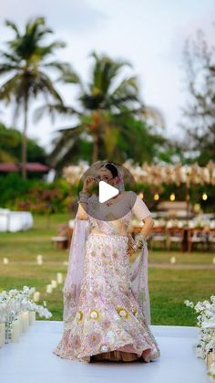 two women in dresses standing at the end of a ceremony