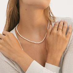 *Buy 2 items, Get 15% OFF your order. Coupon applied at checkout.* Luxurious freshwater pearl necklace. Carefully hand selected cultured fresh water pearls. Pearls are delicate by nature, so handle with care. Our Pearl necklaces are great for wearing by itself or layering. Also makes for the perfect gift! - 18k gold filled - Freshwater pearls - Water resistant / Tarnish resistant / Hypoallergenic - 1 year warranty Pearl Strand Necklace: - Pearl strand thickness: 3.6mm - Adjustable chain 16 to 18 Mother's Day Pearl Jewelry, Mother's Day Pearl White Jewelry With Pearl Charm, Pearl Necklace As Gift For Her, Pearl Charm Necklace, Gift For Her, White Pearl Jewelry Gift For Her, Feminine Single Strand Necklace For Gift, Dainty Clavicle Chain Pearl Necklace For Mother's Day, Dainty Pearl Necklace For Mother's Day, Feminine Pearl Jewelry For Gift