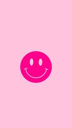 a pink smiley face on a pink background