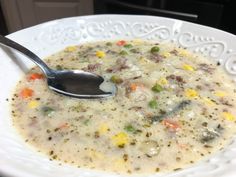 a bowl of soup with a spoon in it