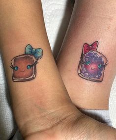 two people with matching tattoos on their arms, one has a cake and the other has a bow