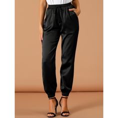 The glossy satin joggers take on a relaxed silhouette for the new season, with sports tailoring with tassel decor giving it a new fashionable elevated twist. Soft satin shapes the stylish pants with an elasticized, drawstring waist and straight legs. An ankle-length and a high-waisted further the cool style of the satin pants that are right for work and any casual occasion. Pair with the matching top for a complete look! Silk Joggers, Athleisure Pants, Satin Joggers, Tassel Decor, Sports Workout, Joggers Black, Joggers Pants, Satin Pants, Stylish Pants