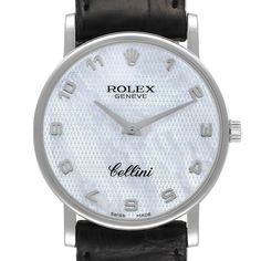 Rolex Cellini Classic White Gold Mother of Pearl Dial Mens Watch 5115. Manual winding movement. 18K white gold slim case 32 mm in diameter. Case thickness: 5.5 mm. Rolex logo on the crown. . Scratch resistant sapphire crystal. Flat profile. Textured mother of pearl dial with raised gold Arabic numerals. Black leather strap with Rolex 18k white gold tang buckle. Modern White Diamond Watch For Formal Occasions, Modern Platinum White Gold Watches, Modern Platinum Watches With Polished Finish, Modern Platinum Watches In White Gold, Modern Platinum Watch With Polished Finish, Classic White Diamond Watch With Polished Finish, White Polished Business Watches, White Watches With Polished Finish For Anniversary, White Formal Watch With Polished Finish