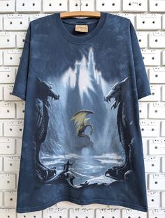 T-shirt in good condition without holes and stains ( PLEASE SEE ALL PHOTO ) Condition: 8/10 Brand: Mountain  Material: 100% Cotton Tag Size: M but fits more like L ( PLEASE CHECK THE MEASURMENTS ) Width from armpit to armpit: 57 cm / 22.5 inch Length: 74 cm / 29 inch Feel free to contact us if you have any questions! Tshirt Style Outfit, Blue Cotton Hippie T-shirt, Blue Hippie Cotton T-shirt, Dragon Graphic Tee, Cotton T-shirt With Dragon Print, Cotton T-shirt With Dragon Print Short Sleeve, Bird Shirt, Hot Outfits, Summer Tshirts