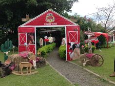 a red barn with fake farm animals in it