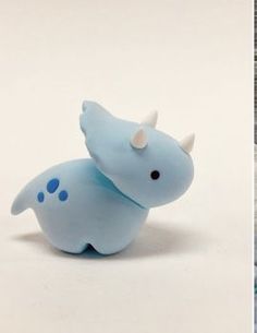 two pictures one is blue and the other has a toy rhinoceros