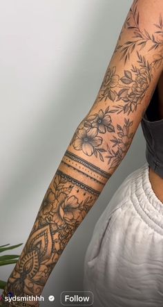 a woman with a tattoo on her arm