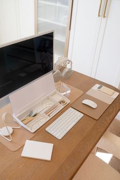 a desk with a keyboard, mouse and monitor on it