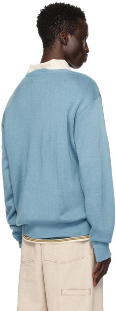 Knit acrylic- and wool-blend sweater. · Rib knit crewneck, hem, and cuffs · Jacquard text at front · Dropped shoulders Supplier color: Light blue Blue Crew Neck Polo Sweater For Fall, Blue Crew Neck Polo Sweater With Ribbed Cuffs, Pastel Blue Sweater, Blue Hand Knitted Acrylic Sweater, Blue Patchwork Crew Neck Sweater, Uniform Bridge, Blue Acrylic Soft Knit Sweater, Blue Hand-knitted Acrylic Sweater, Color Light Blue