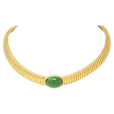 Designed as a tubogas necklace centering an oval-shaped tourmaline cabochon Weighing approximately 17.29 carats - transparent light to medium green Set east to west in high polished bezel Completed by hidden clasp closure Stamped for 18 karat gold Fully signed for Cartier, numbered and with maker's mark for Carlo Weingrill Circa: 1980s Width at widest: 5/8 inch Length: 14 3/4 inches with additional flex Total weight: 56.8 grams Stock Number: We-11673 Formal Oval Cartier Jewelry, Vintage Cartier Watch, Cartier Jewelry, Tourmaline Stone, Tourmaline Necklace, Modern Pendant, Green Tourmaline, Collar Necklace, Link Bracelets