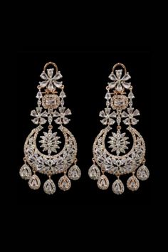 Fadia Kundan Earrings With their stunning cascading silhouette these pair of earrings will inject an extra dose of glamour to your look.  Exquisite chandelier earrings with high-quality CZ stones Approximately earrings size is 4.25 .  Silver-plated on high-quality brass as the base metal. Details: Handcrafted Metal: Silver Plated Stone: CZ stones Dimensions: Length 4.25 inches  Chandelier Earrings Glamorous Hand Set Diamond Bridal Earrings, Glamorous Diamond Bridal Earrings Hand Set, Glamorous Hand-set Diamond Bridal Earrings, Glamorous Diamond Bridal Earrings, Dazzling Hand Set Chandelier Earrings For Wedding, Dazzling Hand Set Chandelier Wedding Earrings, Dazzling Hand-set Chandelier Earrings For Wedding, Diamond White Cubic Zirconia Hand Set Chandelier Earrings, Diamond Hand Set Chandelier Earrings For Wedding