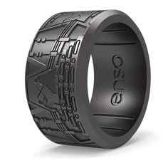 a black ring with an intricate design on it