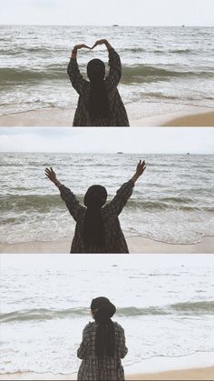 the woman is standing on the beach with her hands in the shape of a heart