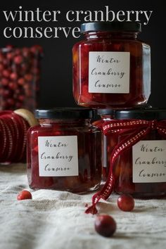 three jars of cranberry preserves with the words winter cranberry preserver on them