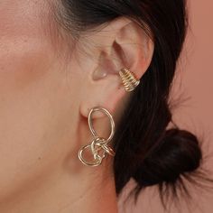 These face framing knots are funky and formal at the same time. Ready for your glam night out or a normal day at the office, you’re guaranteed to get compliments on these. Modern Clip-on Earrings For Party, Modern Clip-on Party Earrings, Modern Party Clip-on Earrings, Trendy Gold Ear Cuff For Party, Modern Gold Ear Cuff For Party, Elegant Clip-on Ear Cuff, Gold Trendy Party Ear Cuff, Trendy Ear Cuff With Matching Earrings For Party, Gold Ear Cuff For Party