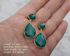 This pair of two tier genuine gemstone (emerald) earrings would be a great reward for your self or a great gift for your mother or best friend. Each one has two tiers of natural stones:1. top tier: a small (11mm) round emerald in gold bezel2. bottom tier: a large pear shaped emerald (natural gemstone) stone (about 25 x 19 mm) set in gold bezel    Note: other stone combinations available. Please inquire.3. earring total length ~ 40 mm4. bezel material: 24k gold plated5. earring wire: 24k gold pla Faceted May Birthstone Earrings Gift, Fine Jewelry Green Drop Earrings, Green Fine Jewelry Drop Earrings, Elegant Green Gemstone Earrings, Elegant Green Emerald Earrings, Green Fine Jewelry Earrings For Party, Green Birthstone Earrings, Emerald Round Earrings For Party, Round Emerald Earrings For Party