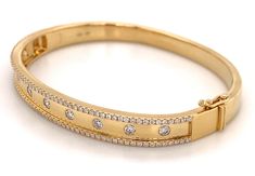 This best-selling style boasts a polished gold finished inlaid with 115 sparkling round-cut diamonds. Two rows of glittering diamonds line this bangle - a great piece to wear alone or as the anchor of a stack. An instant classic that will become your signature. Metal: 18K Yellow Gold Diamond Weight: 1.10ct t.w.Diamond Shape: 115 Round Brilliant cutsSetting: Burnish / InlayBangle Width: 46 X 58mm L: 7mm Luxury Designer Hallmarked Bangle, Luxury Brilliant Cut Bangle Jewelry, Luxury Round Wedding Bangle, Luxury Hallmarked Diamond Bangle, Luxury Single Cut Diamond Engagement Bangle, The Anchor, Diamond Glitter, Diamond Shape, Bracelet Stack