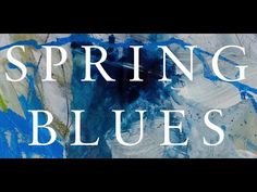 the words spring blues are painted in white and blue on a black background with an abstract painting