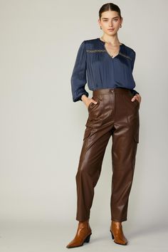 A sleek take on the utility trend. These vegan leather cargo trousers have porkchop pockets at the front, plus streamlined flap pockets at the sides. It's elasticized at the back waistband for added comfort. •Zip fly with button closure •Porkchop pockets at front •Flap pockets at sides •Elasticized back waistband DIMENSIONS •Standard: 28" L of inseam Item number 2370241 Full Length Brown Leather Pants With Pockets, Brown Faux Leather Pants With Pockets, Elegant Full-length Brown Leather Pants, Brown Full-length Leather Pants With Pockets, Brown Faux Leather Full-length Pants, Smock Blouse, Leather Trousers, Cargo Trousers, Pork Chops