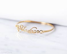 "♥ Personalized Name Bangle is one of a kind personalized jewelry you can find. Perfect gift for you and your loved one. ∙ ∙ ∙ ∙ ∙ ∙ ∙ ∙ ∙ ∙ D E T A I L S ∙ ∙ ∙ ∙ ∙ ∙ ∙ ∙ ∙ ∙ * Material: High Quality Solid Sterling Silver 925 (safe for sensitive skin). * Open bangle style. * Finish: Sterling Silver ∙ Yellow Gold Plated ∙ Rose Gold Plated * Handcrafted with Love and Care ♥ Our 18k gold plated jewelry is much thicker than other gold plating, resulting in a durable, long-lasting product. ∙ ∙ ∙ ∙ ∙ Personalised Bangle, One D, The Bangles, Personalized Bracelet, Open Bangle, Bangles Style, Bangle Designs, Gold Bangle Bracelet, Name Bracelet