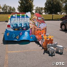 an inflatable float with various animals and decorations on the ground next to it