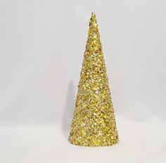 a gold glitter christmas tree on a white background