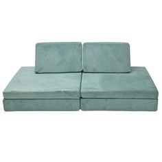 a set of two green couches sitting next to each other on a white background