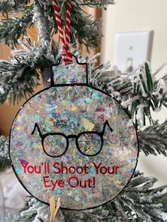 a christmas ornament with glasses on it that says you'll shoot your eye out