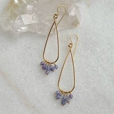 Medium sized teardrop hoops, over 2 inches with a fringe of faceted Tanzanite stones at the base. Metal is 14kt gold fill. Length: approx. 2 inches Material: Tanzanite, gold fill Color: Gold Handmade 14k Gold Filled Teardrop Earrings, Handmade 14k Gold-filled Teardrop Earrings, Nickel-free 14k Gold Filled Teardrop Earrings, Gold Faceted Teardrop Hoop Earrings, Handmade 14k Gold-filled Teardrop Chandelier Earrings, Teardrop 14k Gold Filled Wire Wrapped Hoop Earrings, Teardrop Wire Wrapped 14k Gold Filled Hoop Earrings, Handmade Teardrop 14k Gold Filled Chandelier Earrings, Handmade Teardrop Chandelier Earrings In 14k Gold Filled