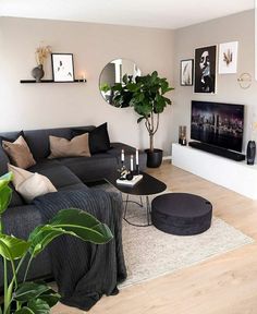 a living room filled with furniture and a flat screen tv