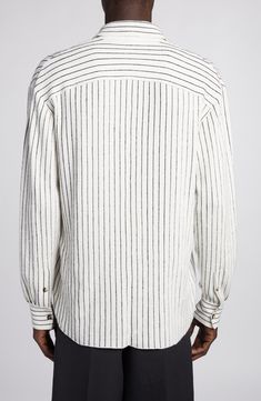 The Italian fashion house offers a relaxed take on a classic button-up with this pinstriped sweater-knit shirt featured in the label's spring '24 runway show. 28 1/2" length; 43" chest (size Medium) Hidden-button placket Spread collar Long sleeves with button cuffs 50% cotton, 50% linen Dry clean Made in Italy Designer Clothing Casual Pinstripe Tops For Business Casual, Classic Pinstripe Tops With Relaxed Fit, Casual Pinstripe Tops With Button Cuffs, Striped Shirt With Button Cuffs For Fall, Striped Tops With Button Cuffs And Relaxed Fit, Rib Stitch, Runway Show, Fashion House, Knit Shirt