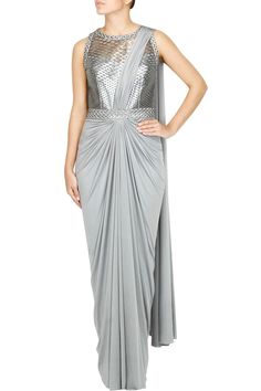 This saree gown is in lycra fabric with silver grey bodice. This saree gown is available in pre drapped. This product will be shipped to you after 3-4 weeks from the date of order placed. Grey Color Saree, Draped Saree Gown, Pre Draped Saree, Amit Aggarwal, Saree Gowns, Faux Metal, Draped Saree, Saree Wearing, Saree Wearing Styles