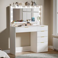 a white vanity with lights on it in a bedroom next to a bed and window