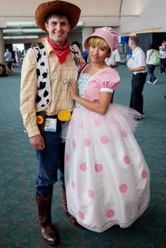 a man and woman in costume standing next to each other