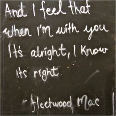 graffiti written on the side of a blackboard with white writing and words that say, and i feel that when i'm with you it's alright, i know its alright, i know