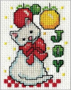 a cross stitch pattern with an image of a dog wearing a santa hat and bow