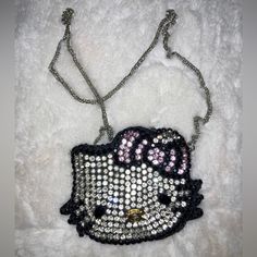 the hello kitty purse is adorned with sequins