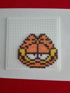 the pixel art is made with legos and plastic beads, but it's so cute