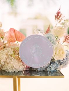 an arrangement of flowers on top of a table