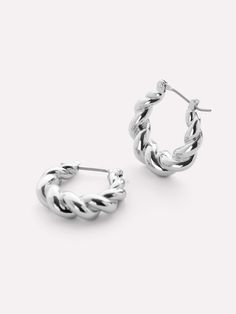 One of our most loved pieces, our twisted hoop Paris earrings, now for our silver babes. A little twisty, a little bendy, a lot of style—these rhodium-dipped hoop earrings are the perfect statement to wear everywhere, every day. Wear our silver twisted hoop earrings alone or pair them with other silver statement pieces like our Rox Mini Silver. • Rhodium-dipped huggie hoops • Features a unique textured look • 365-day warranty Daily Earrings, Wag Dr, Twist Hoop Earrings, Silver Sisters, Twisted Hoop Earrings, Sleek Updo, White Gold Hoops, Everyday Earrings, Gold Hoop