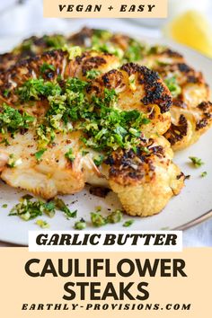 garlic butter cauliflower steaks on a white plate